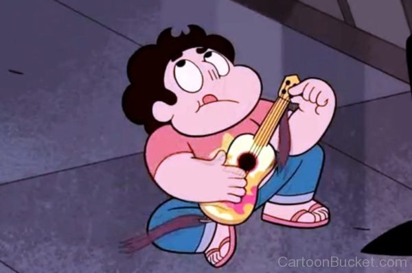 Steven Checking His Guitar